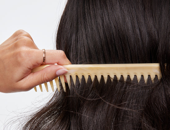 dark hair with comb running through it